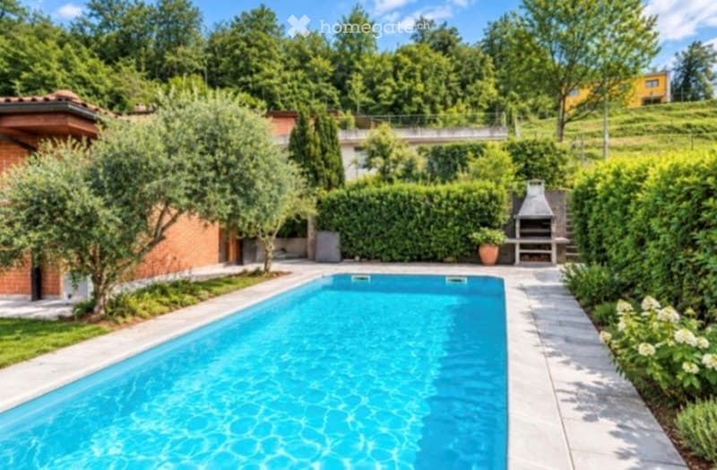 A well-maintained garden area featuring a rectangular swimming pool, surrounded by neatly trimmed hedges, trees, and a brick barbecue area.