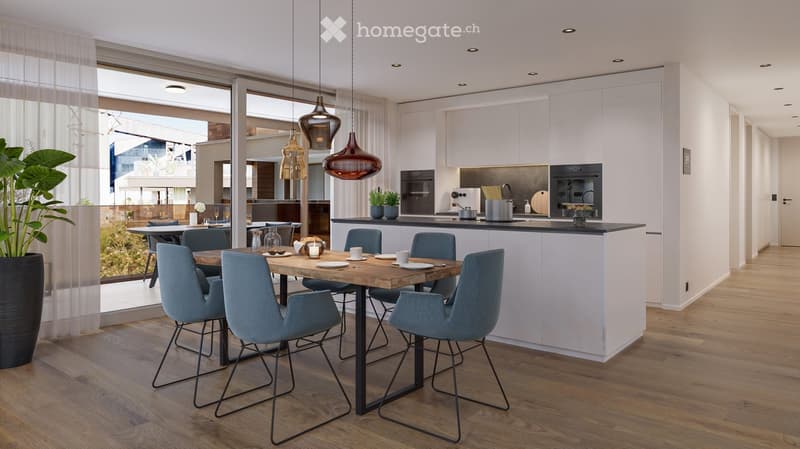 Modern open-plan kitchen and dining area with white cabinets, wooden dining table, blue chairs, pendant lights, and a view through large windows.