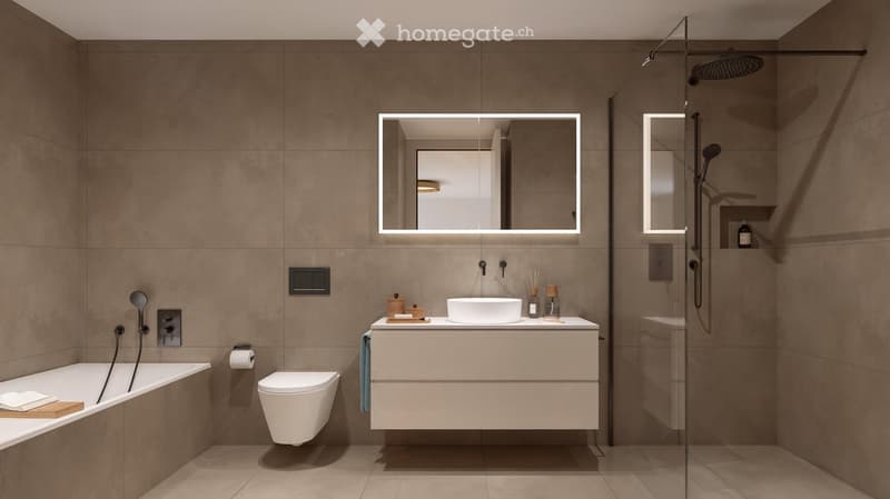 Modern bathroom with a bathtub, toilet, sink, mirror, and shower. Features include a towel, toilet paper, and a light fixture above the mirror.