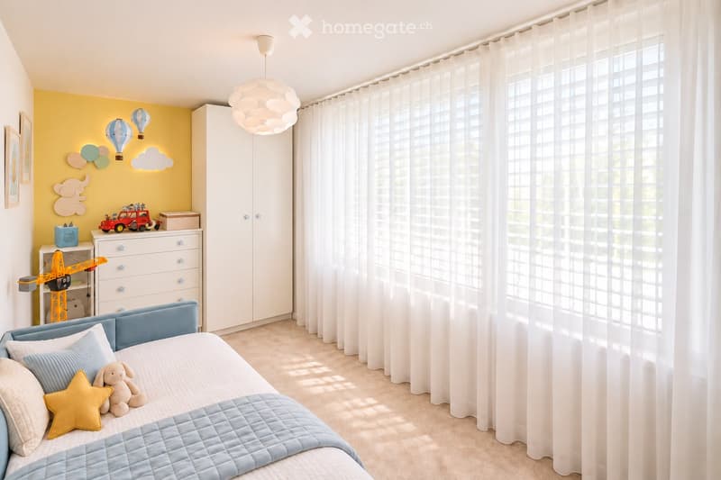 Bright and airy bedroom with a blue bed, white curtains, and a yellow accent wall featuring cloud and balloon decals. Includes a wardrobe, dresser, and various toys.