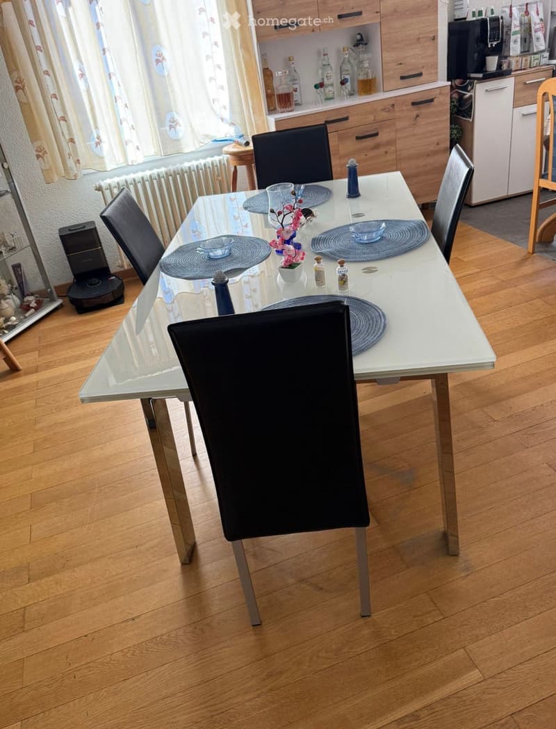 {"type": "Kitchen", "objects": ["dining table", "chair", "cupboard", "bottle", "flower vase", "dish", "bottle", "cup", "bottle", "bottle", "bottle", "bottle", "bottle", "bottle", "bottle", "bottle", "bottle", "bottle", "bottle", "bottle", "bottle", "bottl