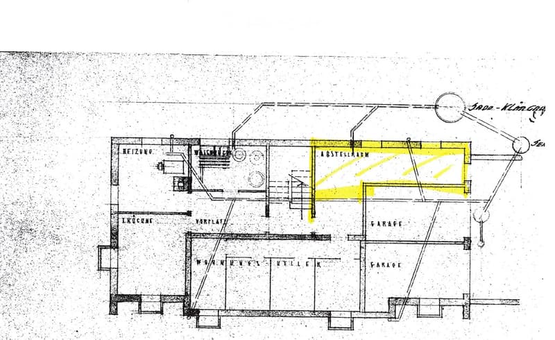 Floor plan of a house with labeled rooms including a kitchen, living room, bedroom, and garage.