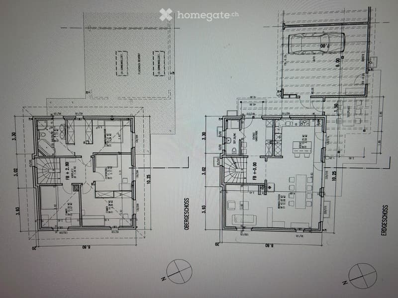 Floor plan showing two levels: upper level with living room, dining area, kitchen, and bedrooms; lower level with garage, utility room, and additional living space.