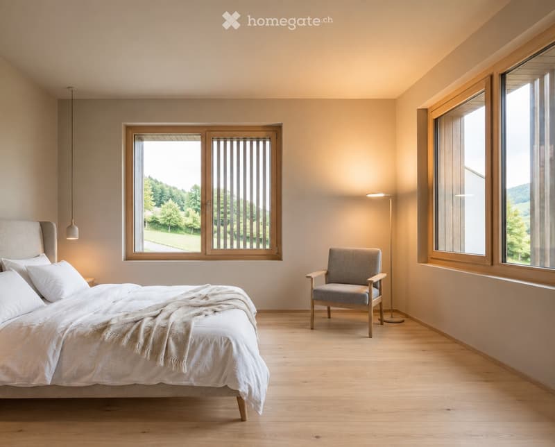 Modern, minimalist bedroom with a large bed, a single armchair, and a floor lamp. Large windows offer a view of greenery outside.