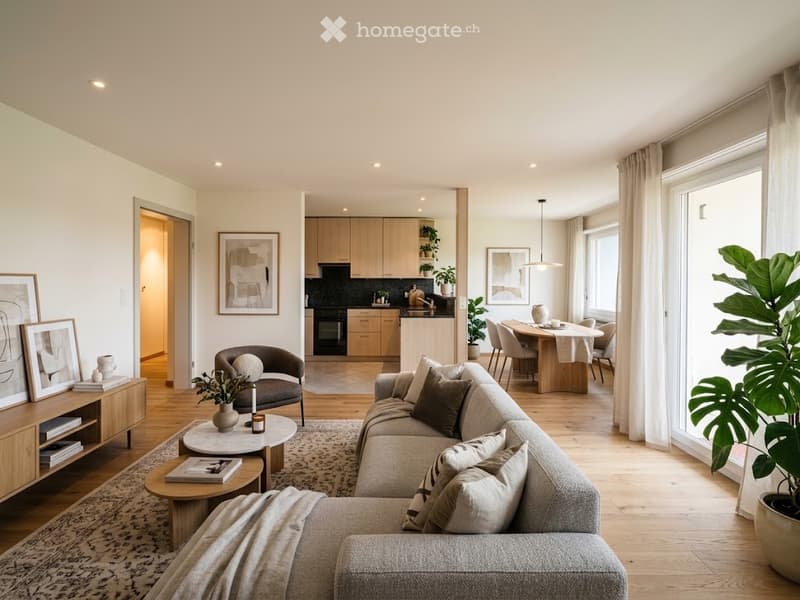Modern, open-concept living and dining area with light wood flooring, large windows, and neutral-colored furniture including a sectional sofa, coffee table, armchair, dining table with chairs, and kitchen area with cabinets and appliances.