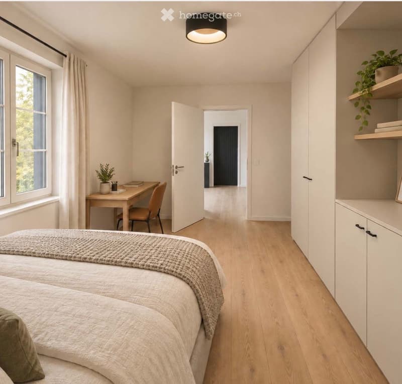 Bright bedroom with two single beds, a desk with a chair, built-in white cabinetry, and a shelf with a plant. Large windows with curtains and a hallway leading to another room.