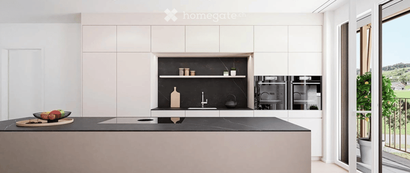 Modern kitchen with white cabinets, black countertops, and stainless steel appliances. Features a sink, oven, and decorative items on shelves.