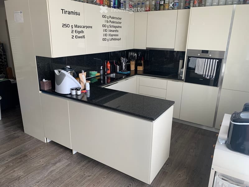 {"type": "Kitchen", "objects": ["oven", "sink", "faucet", "electric kettle", "cupboard", "bottle", "oven mitt", "towel", "cupboard", "bottle", "bottle", "bottle", "bottle", "bottle", "bottle", "bottle", "bottle", "bottle", "bottle", "bottle", "bottle", "b