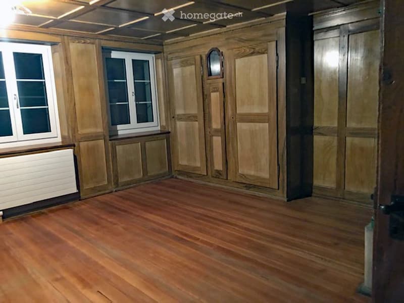 empty room, wooden flooring, wooden panels, windows, closets