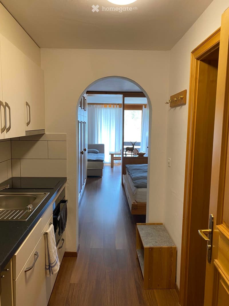 kitchen, open hallway, double bed, small bed, bathroom