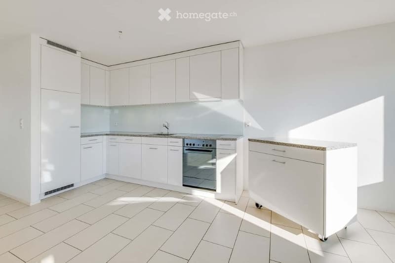Modern kitchen with white cabinets, a stainless steel oven, a sink, and a white island with granite countertop.