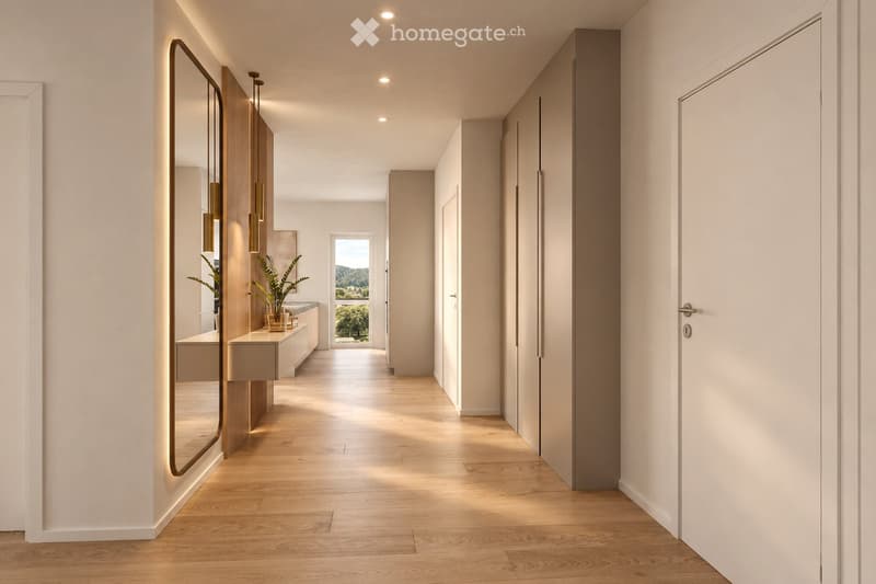 Modern hallway with light wooden flooring, white walls, recessed lighting, and a large mirror on one side. A small plant and a bench are visible in the background, with a view of the outdoors through an open doorway.