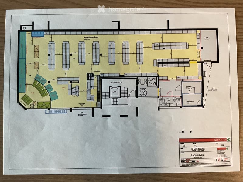 Floor plan of a commercial space with multiple storage units, a staircase house, a lift, a WC, and various labeled areas including a sales area, storage, and customer entrance.