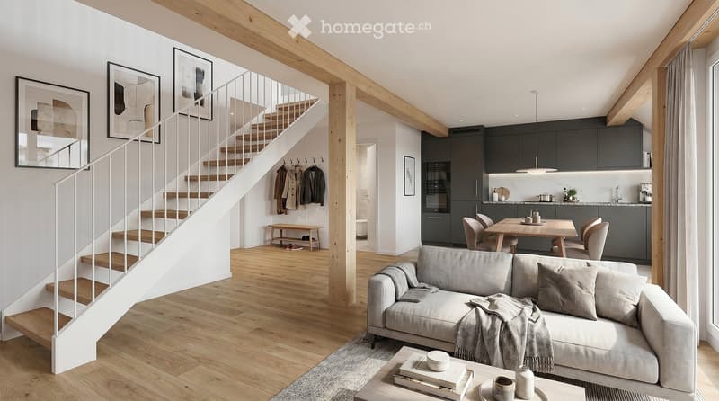 Modern living and dining area with exposed wooden beams, a grey sofa, coffee table, dining table with chairs, and a staircase leading to an upper level.