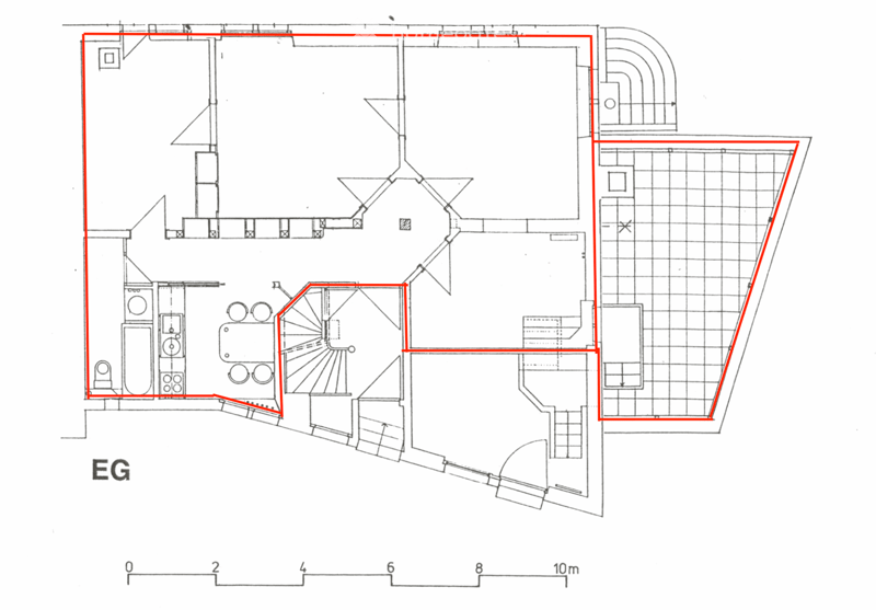 Ground floor plan showing a living room, kitchen, dining area, and several bedrooms and bathrooms.