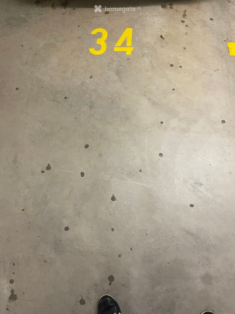 Floor plan showing a concrete floor with the number "34" painted in yellow.