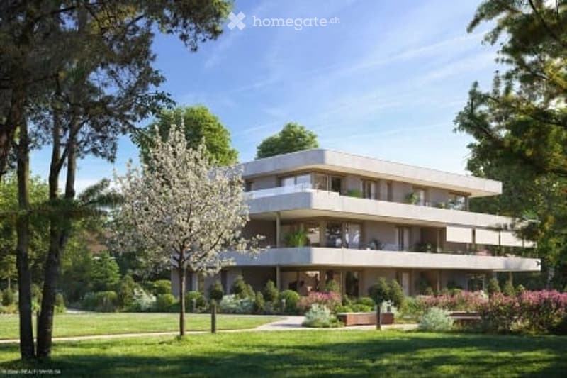 Modern multi-story residential building with balconies, surrounded by a well-maintained garden with trees and shrubs.