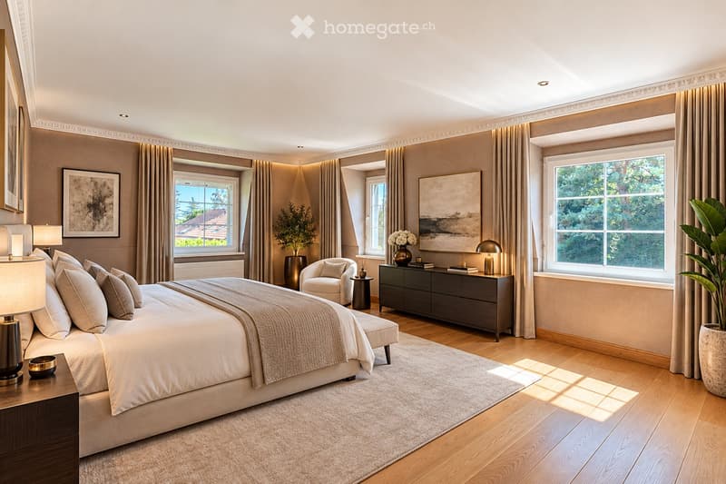 Elegant bedroom with a large bed, nightstands, lamps, a chair, a small table with a vase, and large windows with curtains. The room features wooden flooring and decorative artwork.