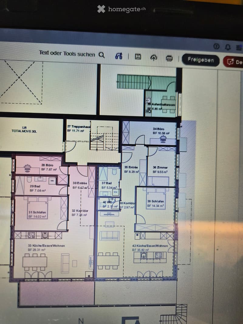 Floor plan of a multi-room building with labeled areas including offices, bedrooms, bathrooms, corridors, and kitchen/dining/living spaces.