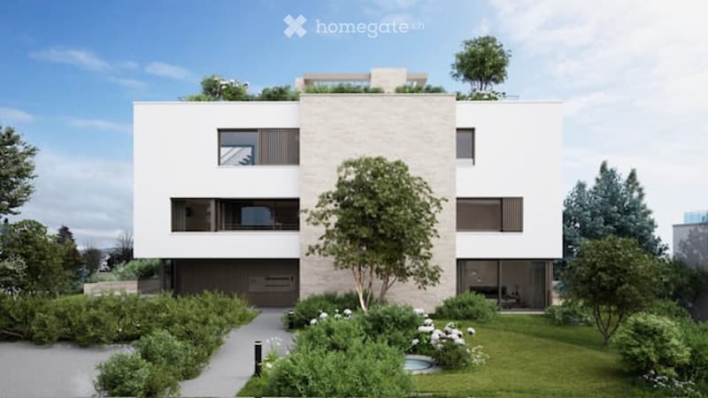 Modern two-story house with white facade, large windows, and a rooftop terrace. The house is surrounded by a well-maintained garden with a small swimming pool, trees, and shrubs.