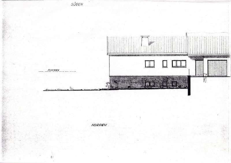 Floor plan of a single-story house with a flat roof, multiple windows, and a garage.