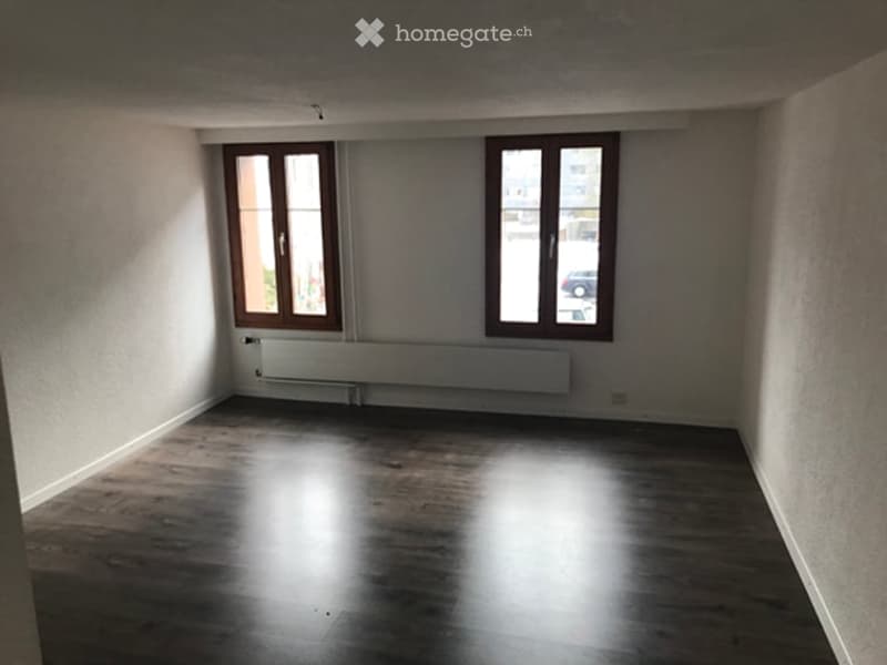 Completely empty room with bare walls and wooden floor. No furniture or equipment.