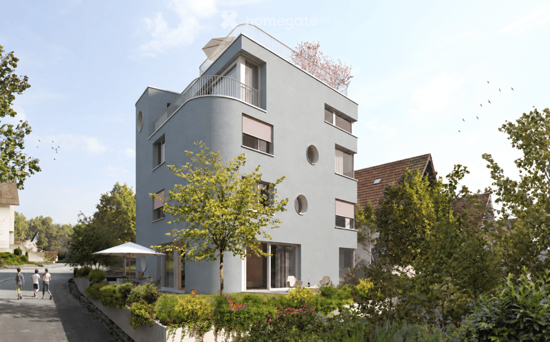 Modern, multi-story building with a sleek, contemporary design, featuring large windows, a rooftop terrace, and surrounding greenery.