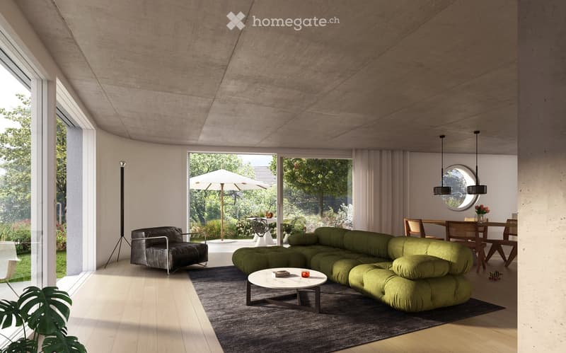Modern living room with a green sectional sofa, black leather armchair, white coffee table, dining area with wooden chairs, pendant lights, and large windows overlooking a garden with an umbrella.