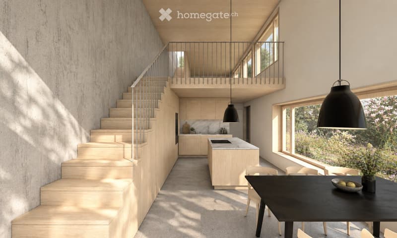 Open-plan living space with a staircase leading to an upper level, a modern kitchen island, pendant lights, and a dining area with a black table and chairs.