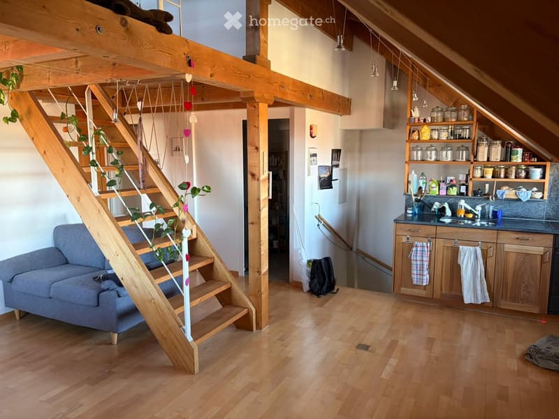 wooden staircase, wooden floor, wooden wall, grey couch, kitchen, wooden shelves