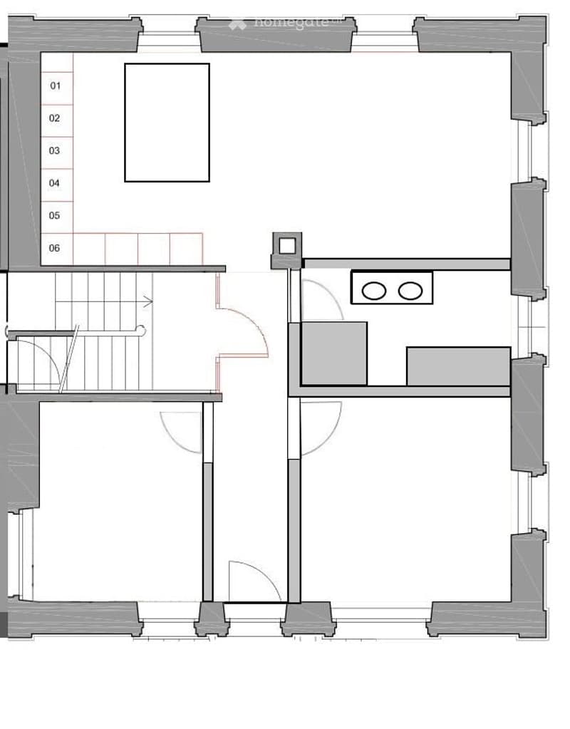 Floor plan of a multi-level building with labeled rooms, including a staircase, kitchen, and several bedrooms.