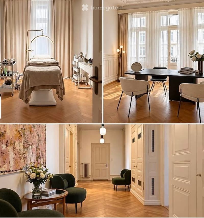 Three distinct rooms: a bedroom with a bed, a workspace with a desk and chairs, and a lounge area with green armchairs and a coffee table.