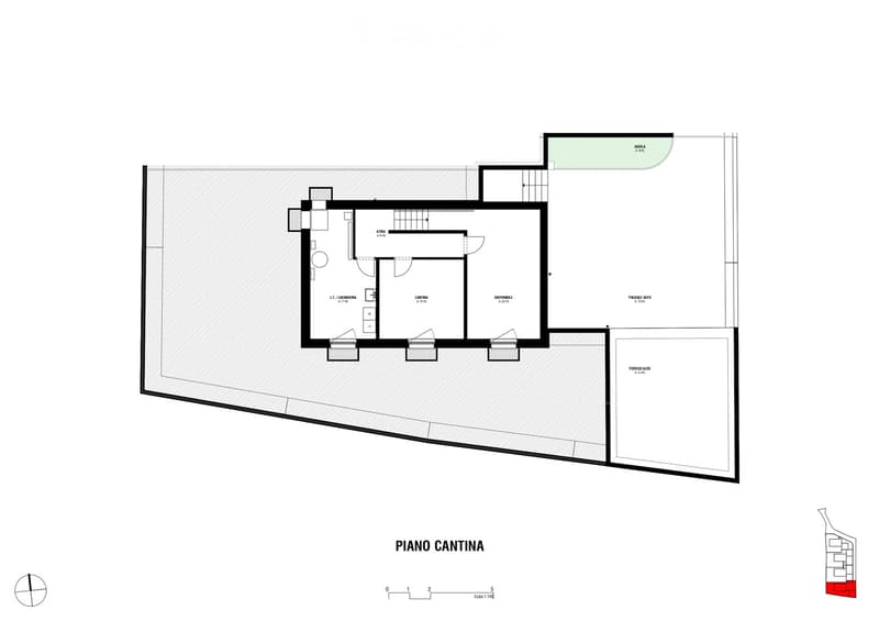 Layout of a basement level showing a kitchen area, utility room, storage space, and parking area.
