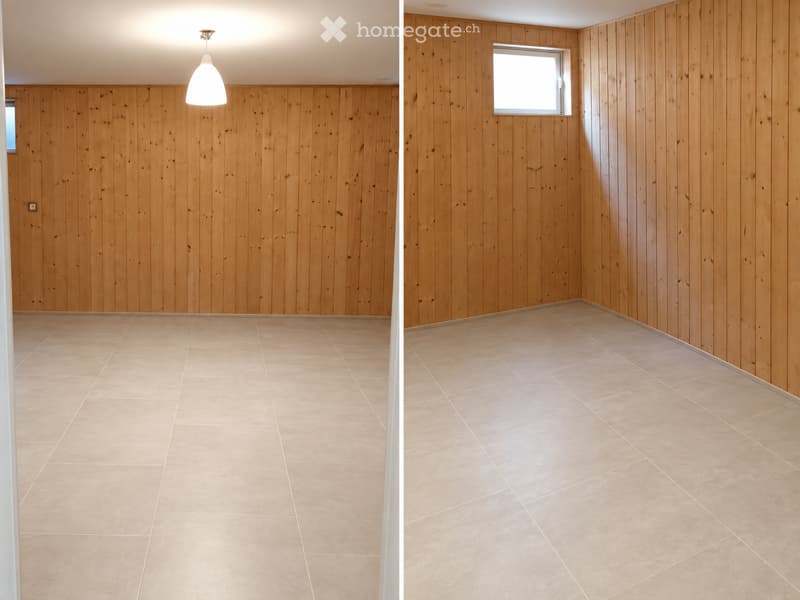 Two empty rooms with wooden panel walls and tiled floors, each featuring a single window and a pendant light fixture.