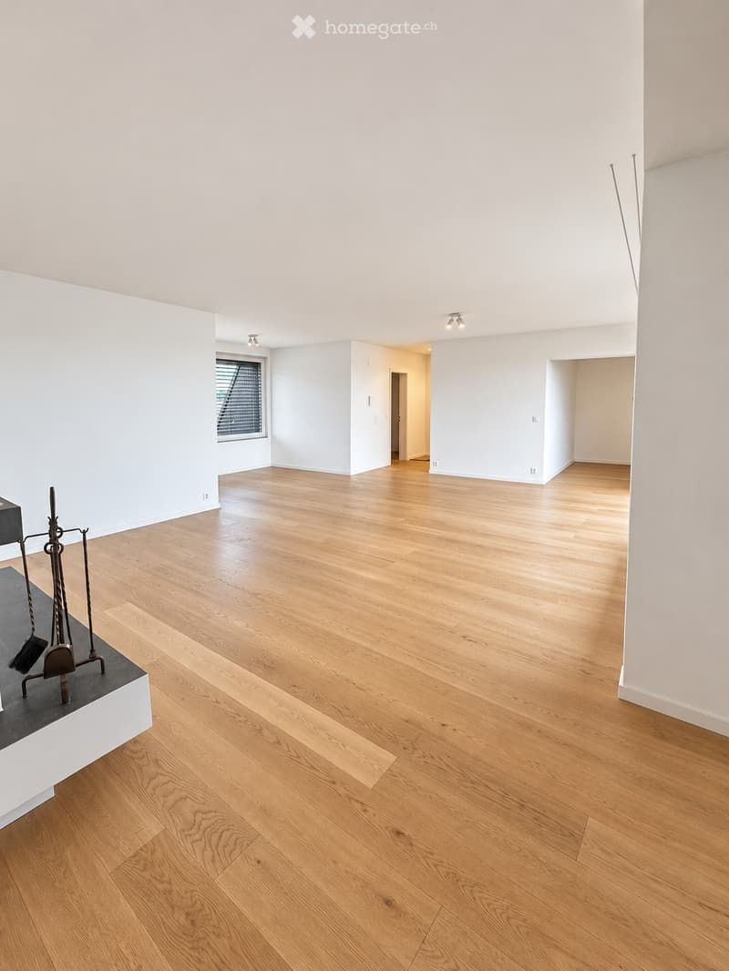 Completely empty room with bare walls and wooden floor. No furniture or equipment.