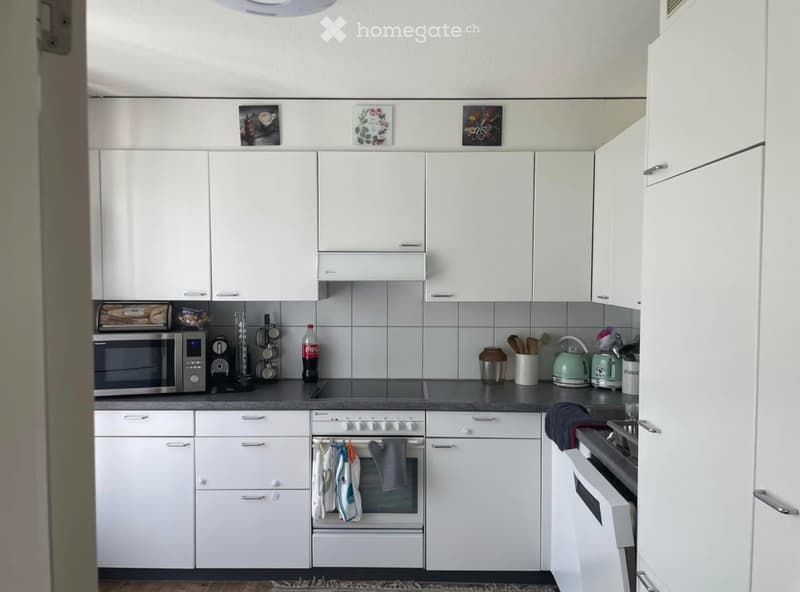 {"type": "Kitchen", "objects": ["oven", "microwave", "cabinets", "kitchen island", "teapot", "cupboard", "bottle", "oven mitts", "toaster", "cupboard", "cupboard", "cupboard", "cupboard", "cupboard", "cupboard", "cupboard", "cupboard", "cupboard", "cupboa