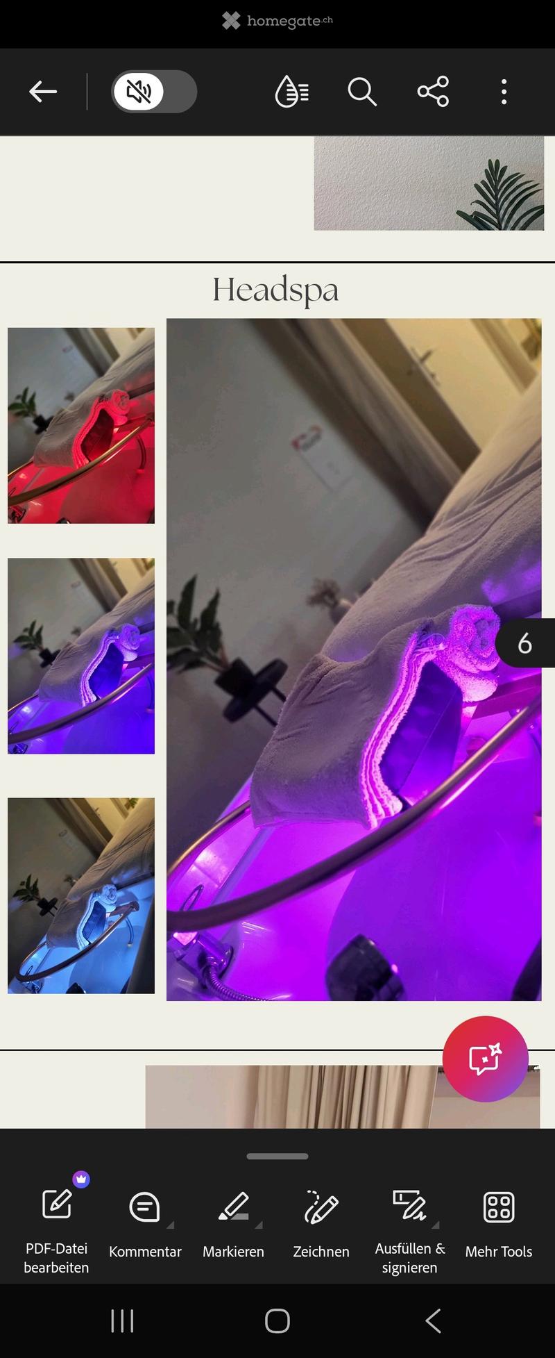 A headspa setup with a large, illuminated bowl and a towel draped over the side, likely for a relaxing spa treatment.
