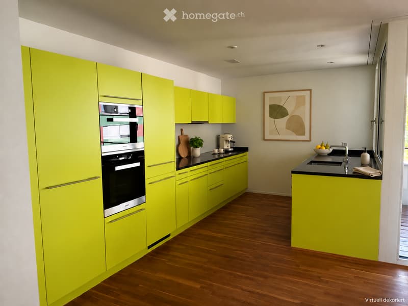 Modern kitchen with bright yellow cabinets, black countertops, and wooden flooring. Features an oven, sink, and various small appliances.