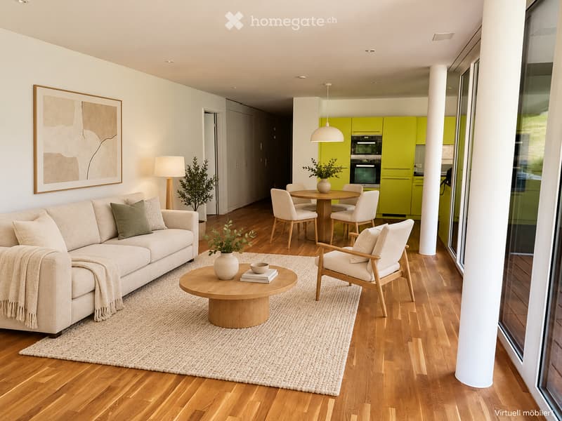 Modern living room with a beige sofa, coffee table, armchairs, dining table, and kitchen area with green cabinets and appliances.