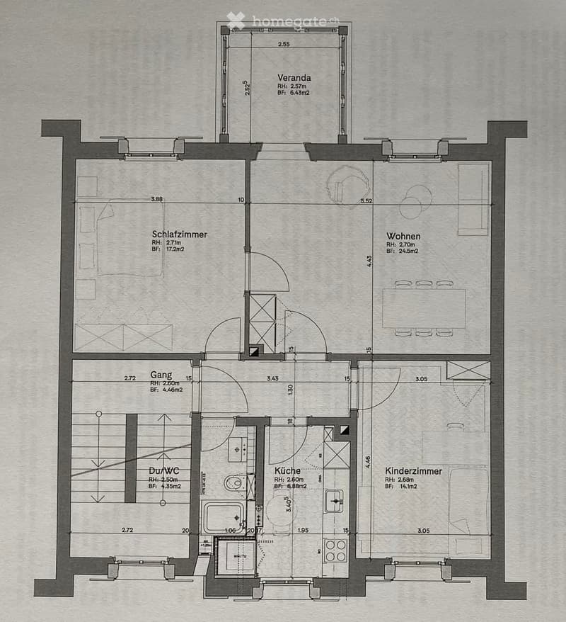 Floor plan of a house with labeled rooms: Schlafzimmer (bedroom), Wohnen (living room), Gang (hallway), Du/WC (bathroom), Küche (kitchen), Kinderzimmer (children's room), and a Veranda (balcony).