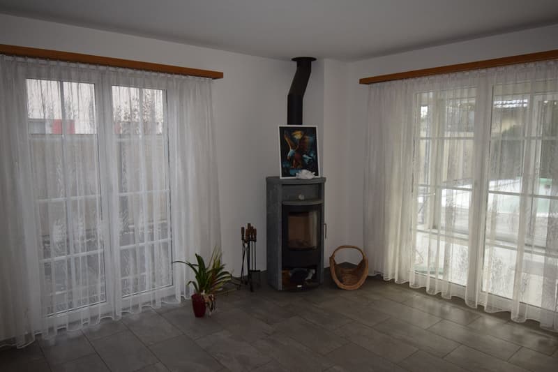 white curtains, fireplace, potted plant, picture frame
