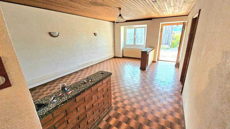 empty room, brick flooring, wooden ceiling, electrical outlets, windows, entrance door