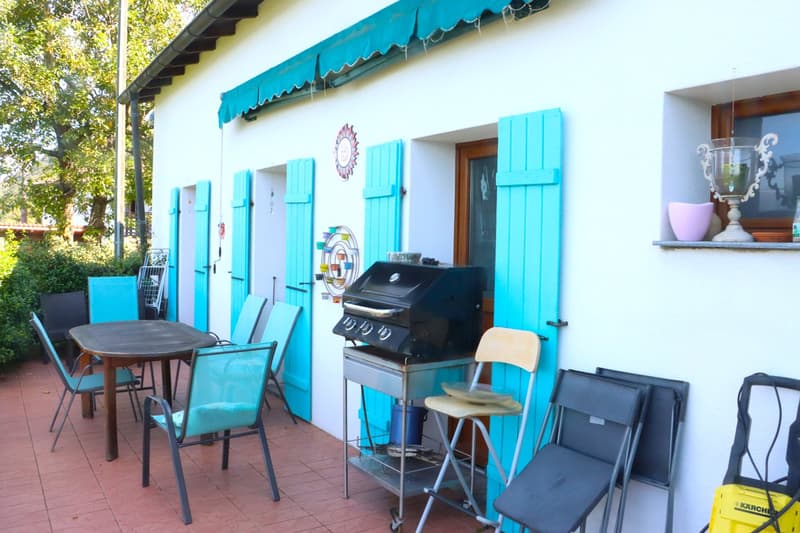 outdoor area with dining table, chairs, griller, folding chairs, yellow object