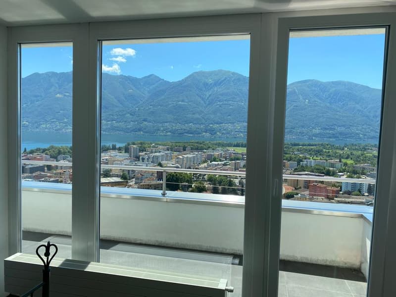 city view, balcony, mountains, large windows