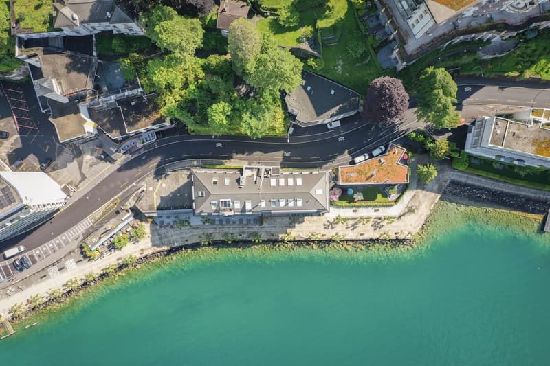 Lakeside apartment complex with green roofs, close to the water, residential area