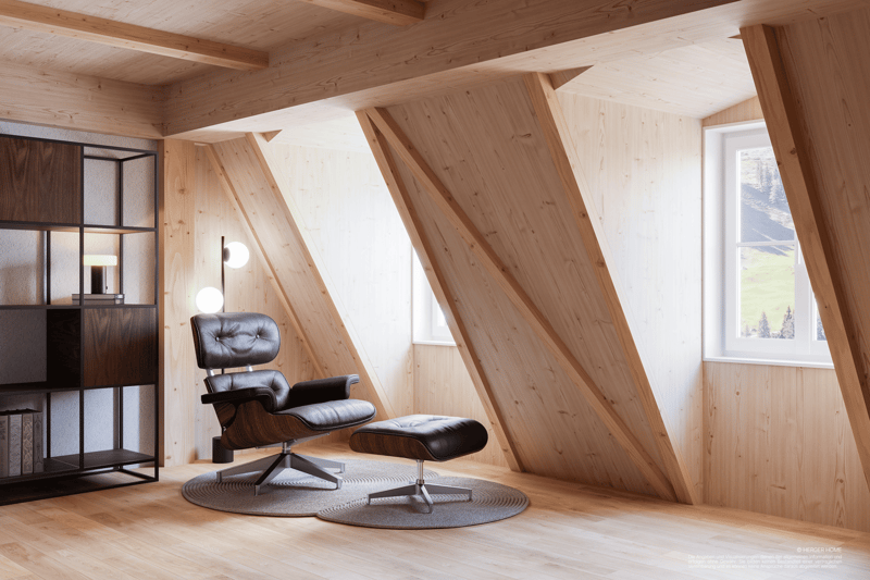 A room featuring a leather chair and footrest on a carpet, modern wooden shelves against the wall, small table lamp on the left, a ceiling with exposed wooden beams, and two slanted windows.