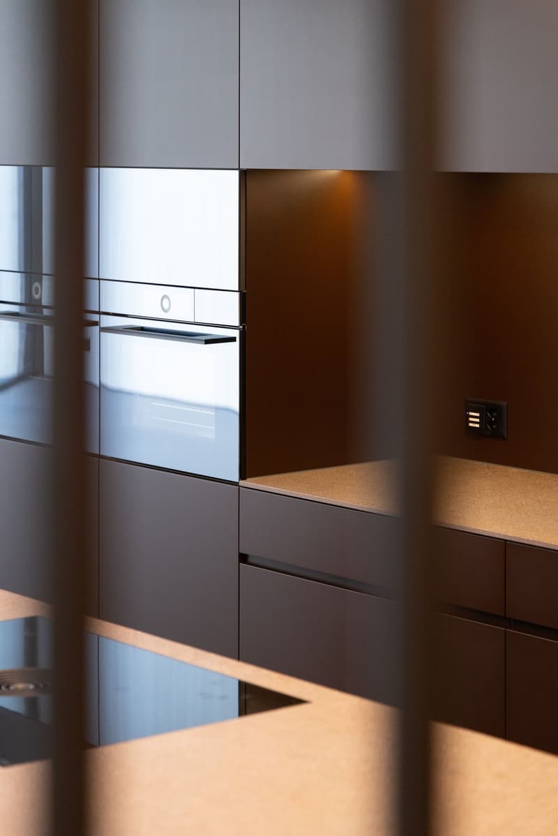 modern kitchen, stainless steel appliances, wooden cabinets, granite countertops, power outlet