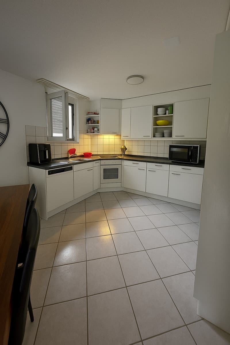 modern kitchen with white cabinets, tiled floor, dishwasher, toaster, microwave, oven, sink
