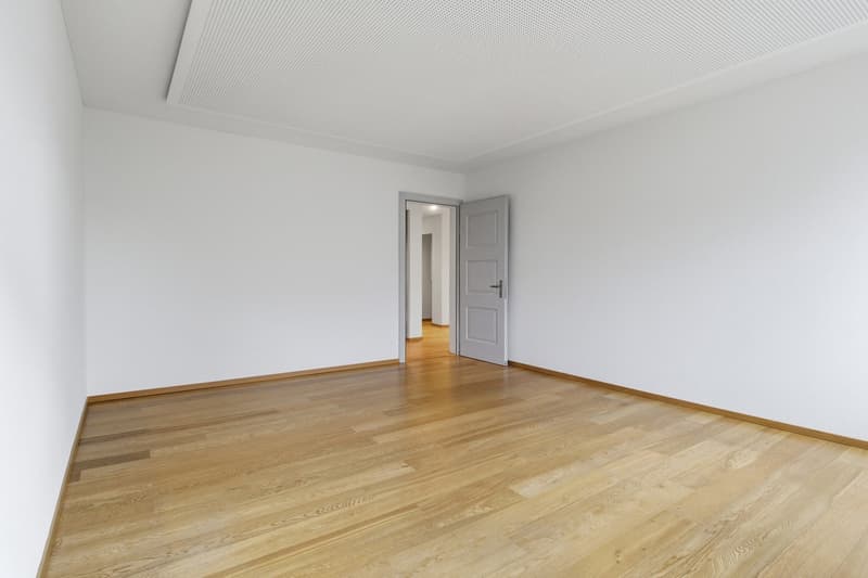 empty room, white walls, wooden floor, open door