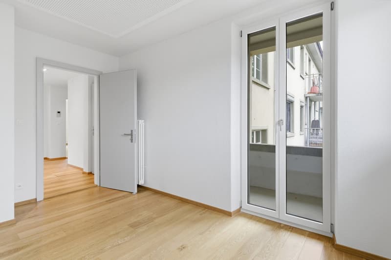 empty room, white walls, wooden floor, sliding glass door, balcony